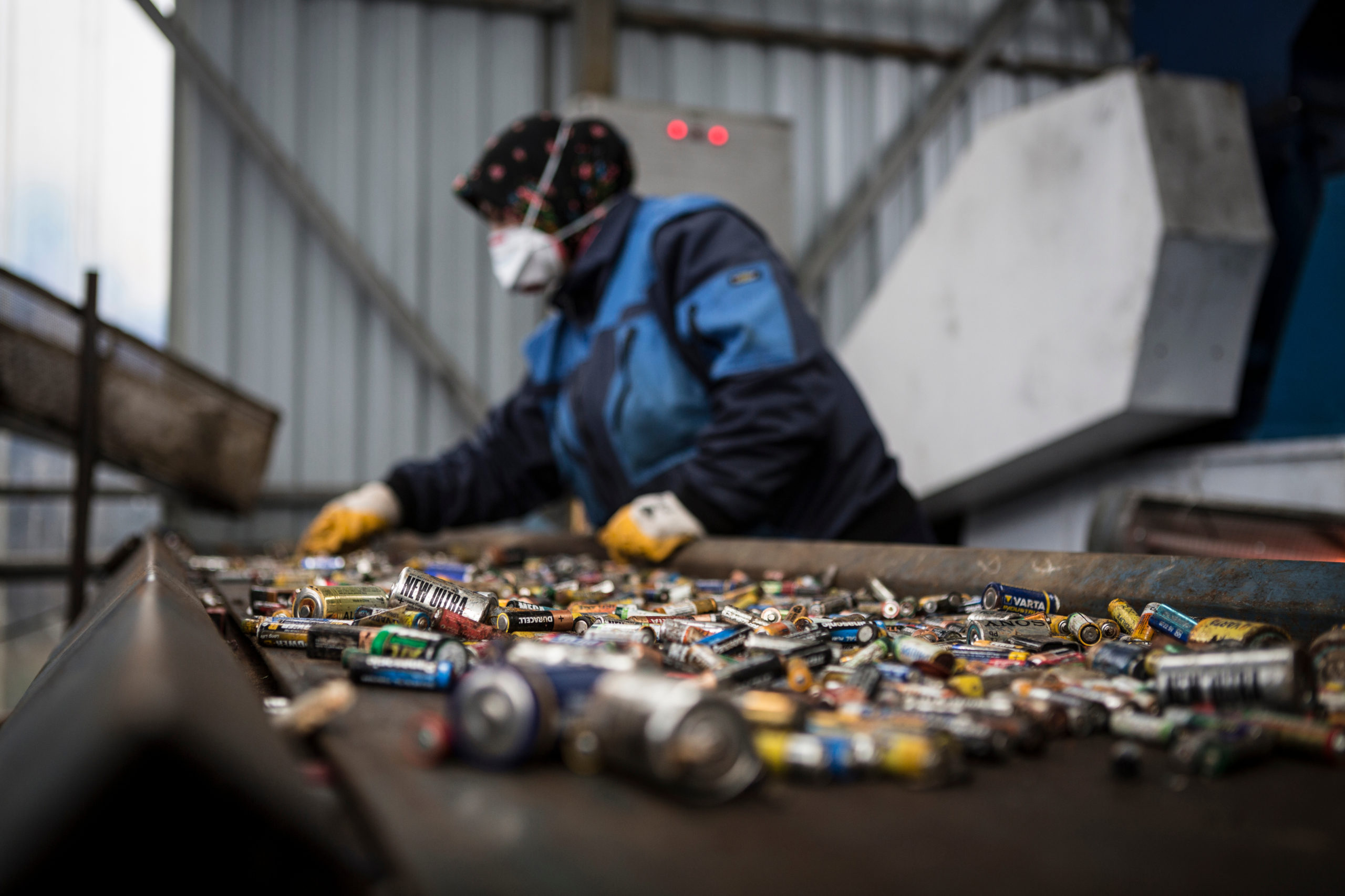 A Turkish worker sorting battery waste